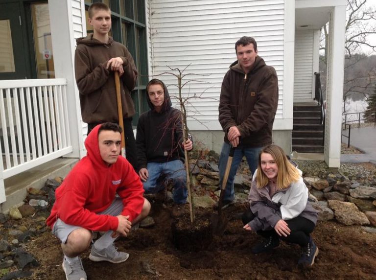 CBNA Landscaping students (left to right) Matt Messenger, Colin Golihur, John Renner, Devin Sullivan, and Sarah Jensen plant tree donated by Patuckaway Nursery.